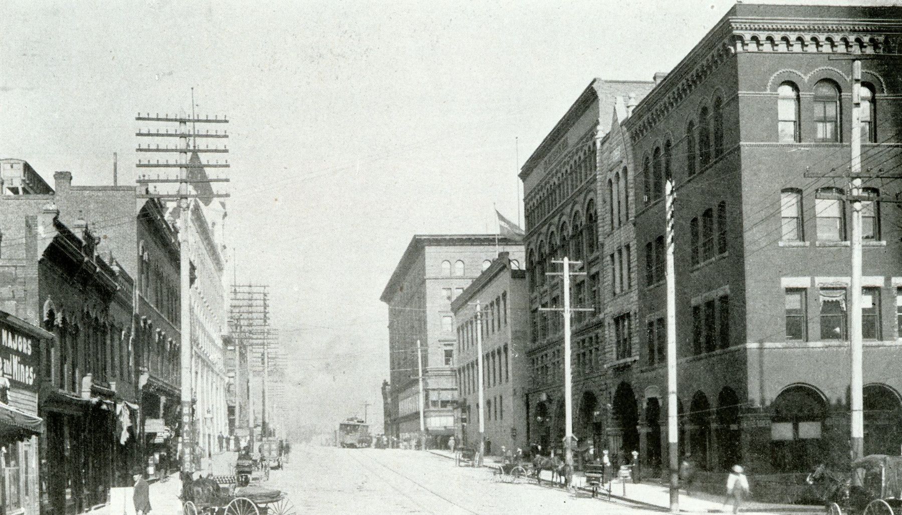 Granite Street in Uptown Butte around 1900, lined with multi-story brick buildings and telegraph poles