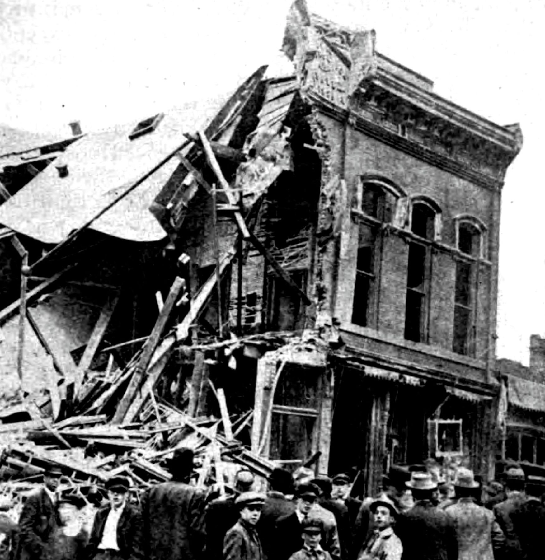 Crowd in front of the wrecked Butte Miners' Union Hall after it was dynamited in June 1914