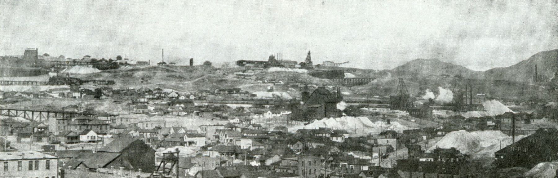 Panoramic view northeast across the west slope of Butte hill around 1900, houses among mine works